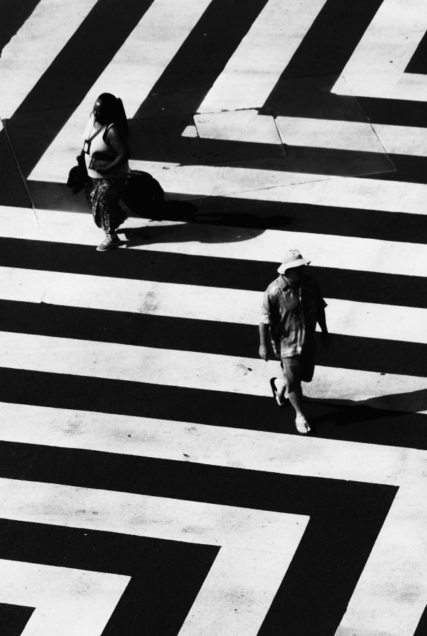 People walking on a zigzag pattern