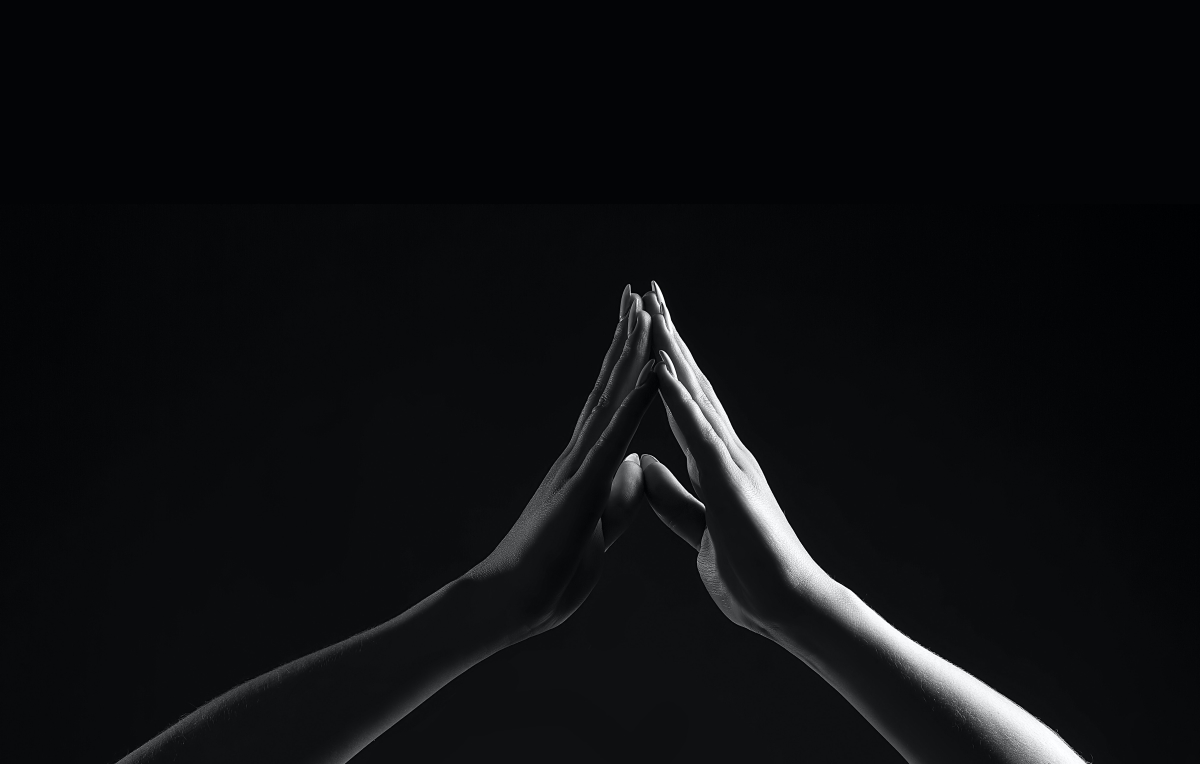Two hands forming a triangle
